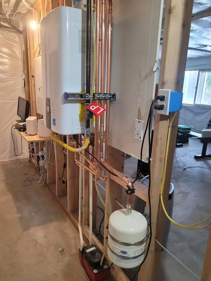 Licensed plumber repairing a kitchen sink in Meriden